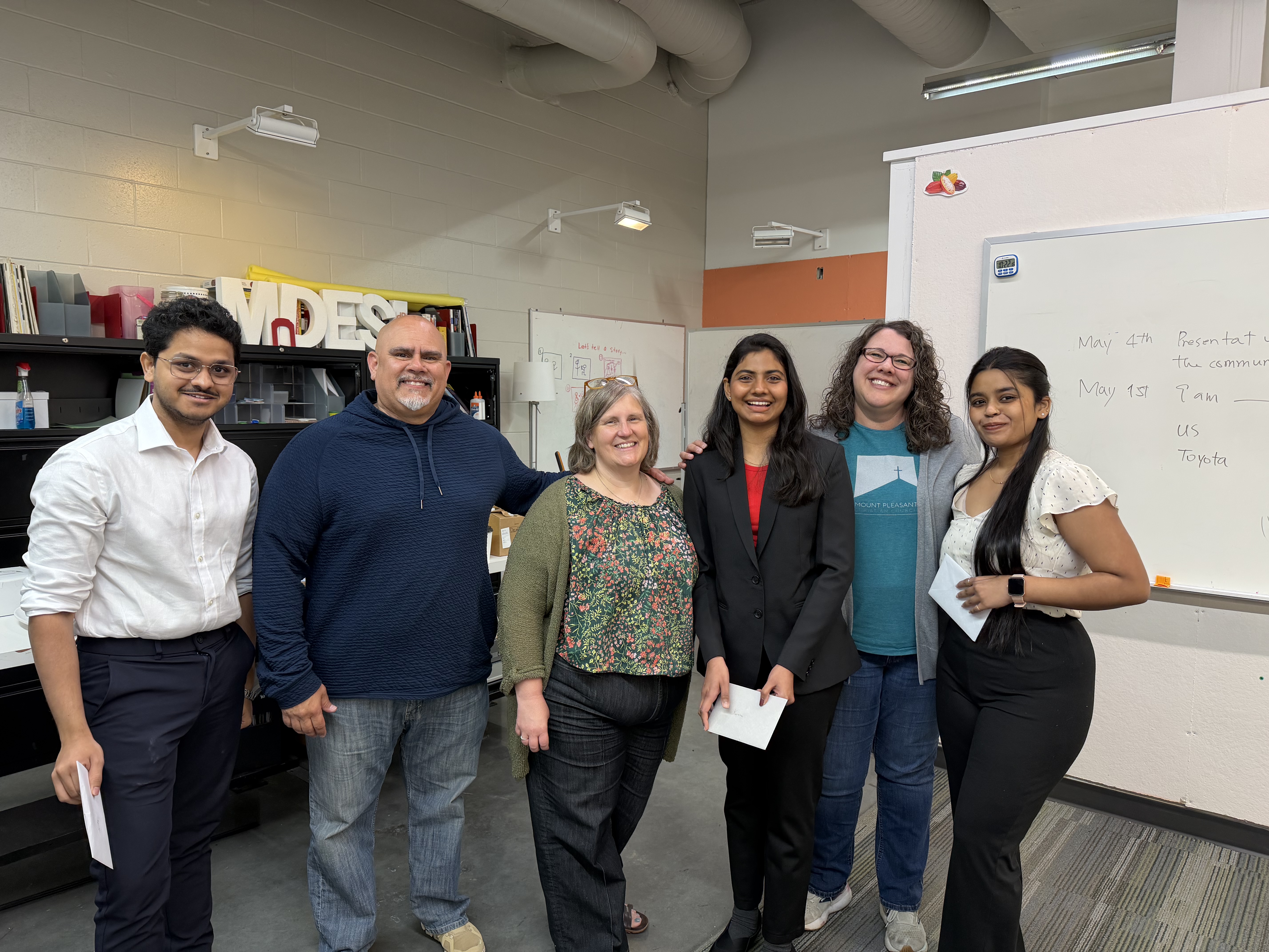 The team with IMPACT Center stakeholders at handoff