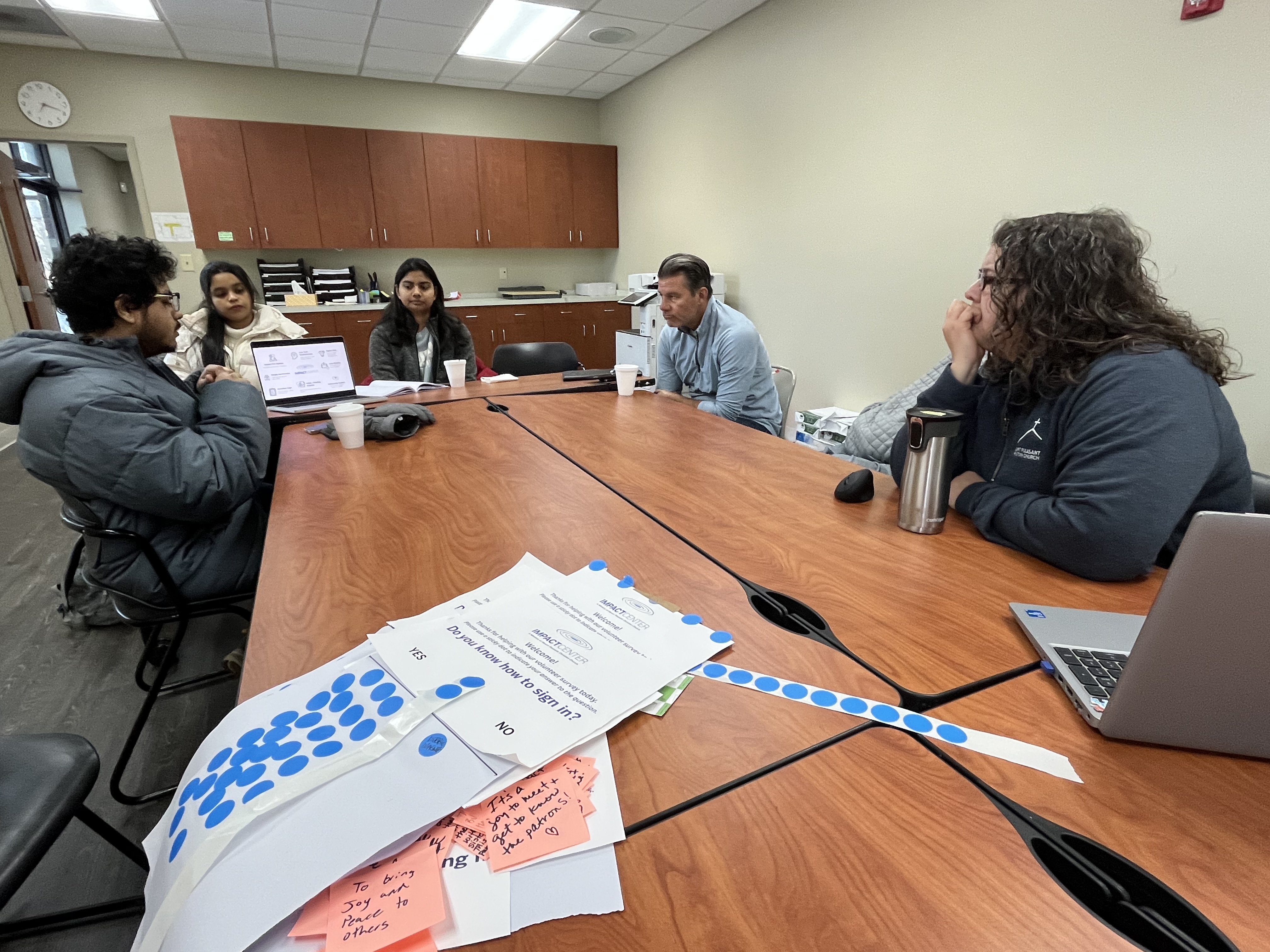 Workshop conclusion meeting with volunteers and staff